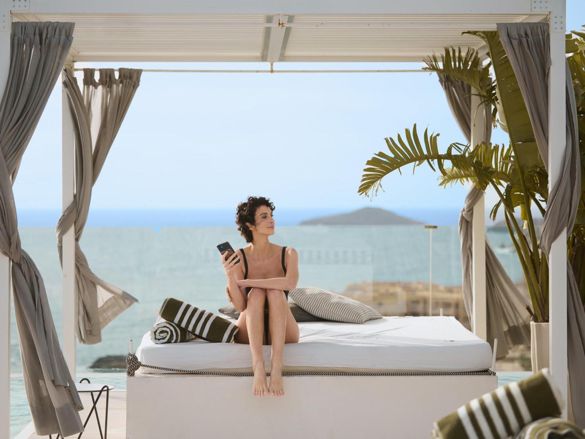 Bless Hotel Ibiza - The Leading Hotels Of The World Es Cana Exterior foto A woman relaxing at a resort